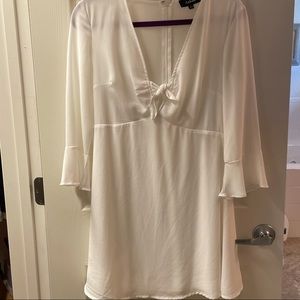 Beautiful white Aakaa dress with bell sleeves